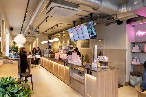 Interior of Joe & The Juice Windsor showing counter, joinery, lighting and exposed ductwork