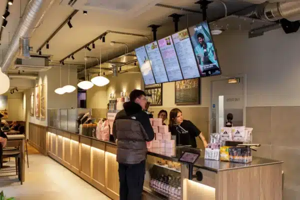Joe & The Juice Windsor counter area with exposed ductwork and ceiling-mounted building services