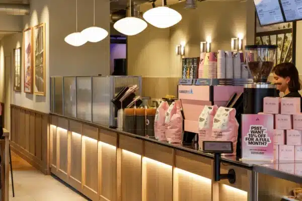 Bespoke timber counter and illuminated joinery inside Joe & The Juice Windsor